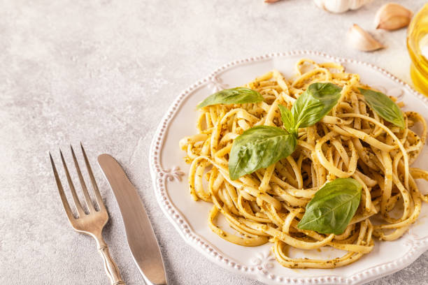 istock Pasta with homemade pesto sauce. 894541710