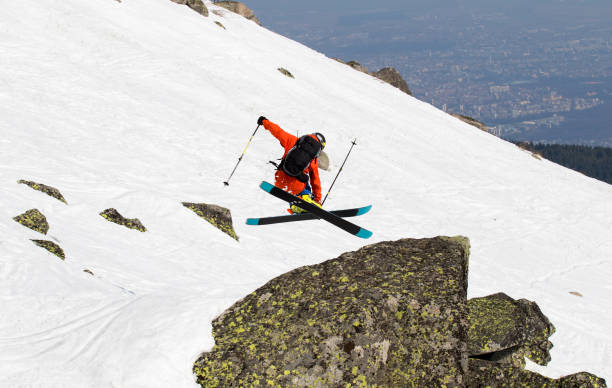 istock Freestyle skier fly over a rock with a trick 894541842