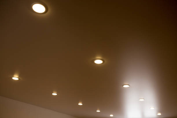istock lamps on a stretch ceiling in a room 894550274