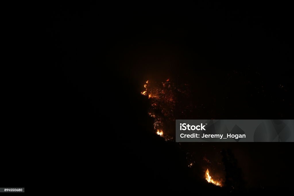 The Thomas Fire burns brightly at night in the hills above Ojai, California. 2017 Stock Photo