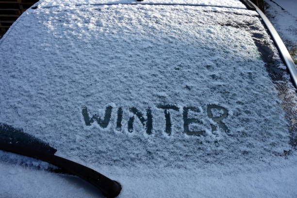 istock Winter text on the snowy car window 894555070