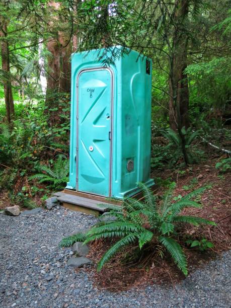 istock Camping Rustic Green Portable Toilet Potty Outhouse Bathroom in Forest 894555830
