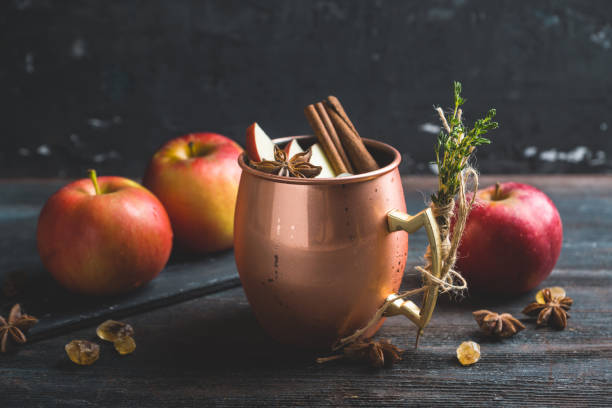 istock Cold Moscow Mule cocktail in copper mug on the rustic background 894559156