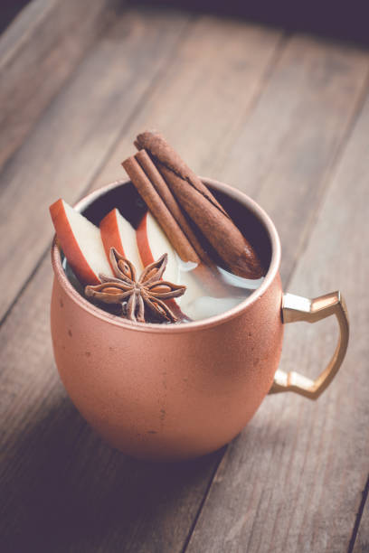 istock Cold Moscow Mule cocktail in copper mug on the rustic background 894559170