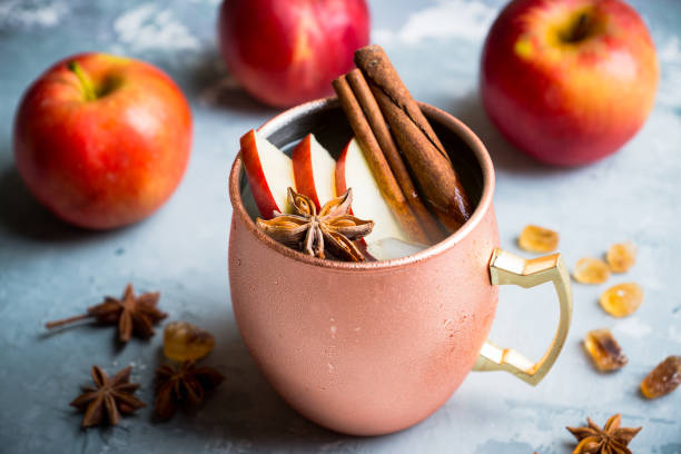 istock Cold Moscow Mule cocktail in copper mug on the rustic background 894559172