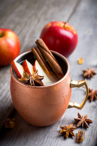 istock Cold Moscow Mule cocktail in copper mug on the rustic background 894559196