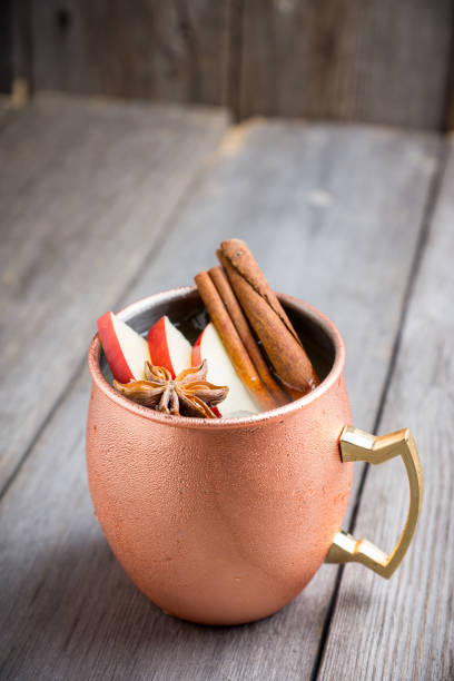 istock Cold Moscow Mule cocktail in copper mug on the rustic background 894559218