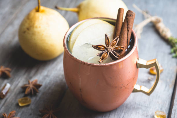 istock Cold Moscow Mule cocktail in copper mug on the rustic background 894559220