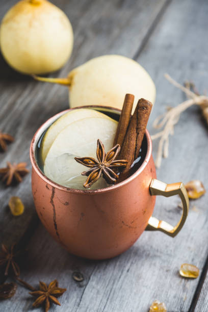 istock Cold Moscow Mule cocktail in copper mug on the rustic background 894559234