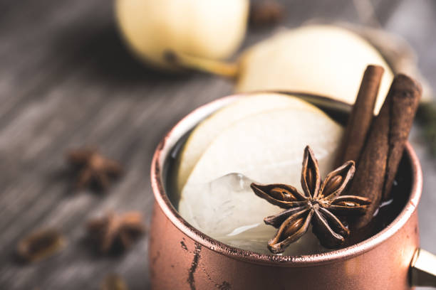 istock Cold Moscow Mule cocktail in copper mug on the rustic background 894559240