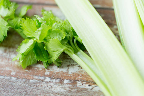 istock close up of celery stems on wooden table 894571070