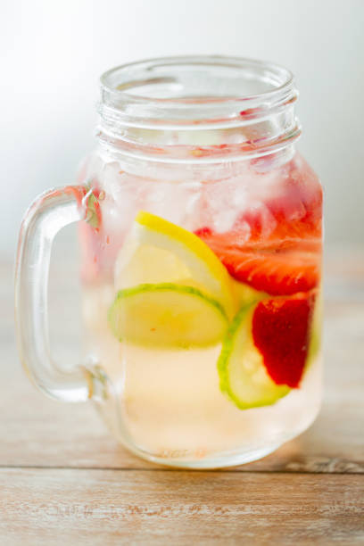 istock close up of fruit water in glass bottle 894571172