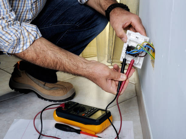istock Electrician working in a residential electrical system 894576750