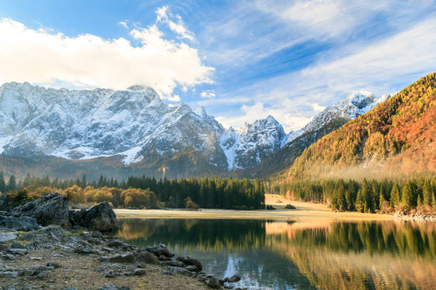 istock autumn sunrise at the alpine lake 894582648