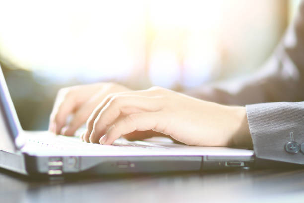 istock men's hands typing on a laptop keyboard 894586356