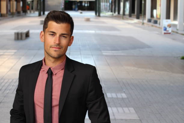 istock Confident handsome young businessman smiling 894586594