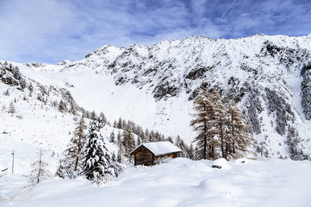 istock Alpine hut covered by the snow 894586978