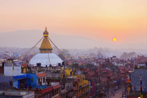 Kathmandu city view Kathmandu city view on the early morning on sunrise with rising sun and famous buddhist Boudhanath Stupa temple. Tibetan traditional architecture, Nepal. gompa stock pictures, royalty-free photos & images