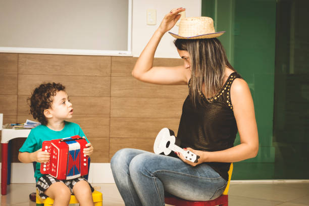 istock Mom and son playing music 894596608