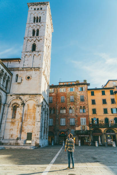 istock Man walking in Lucca, Italy 894596650