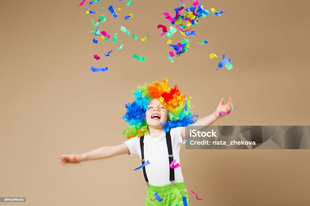Happy Clown Boy In Large Colorful Wig Lets Party Funny Kid Clown 1 April  Fools Day Concept Stock Photo - Download Image Now - iStock