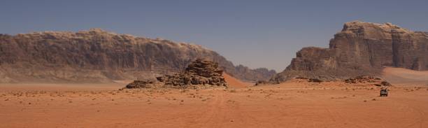Panoramic view of a warm desert Landscape with desert of Wadi Rum Valley, Jordan lawrence in arabia stock pictures, royalty-free photos & images