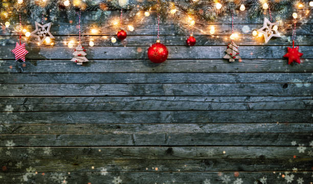 istock Christmas background with wooden decorations and spot lights. 894600034