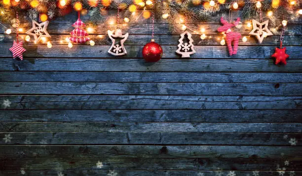 Christmas background with wooden decorations and spot lights. Free space for text. Celebration and decorative design. Very high resolution