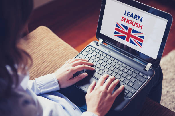 istock Female learning english at home with a laptop. 894602506