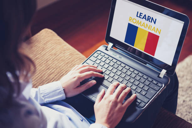 istock Female learning romanian at home with a laptop. 894602884