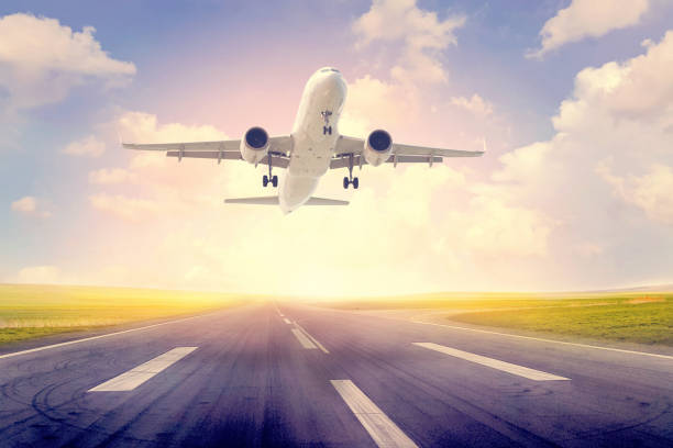 istock Passenger airplane taking off at sunset 894603250