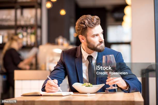 Businessman Dinning At The Restaurant Stock Photo - Download Image Now - Men, Restaurant, Eating