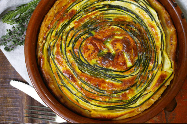 istock Homemade quiche vegetable pie with green courgette and carrot 894618480