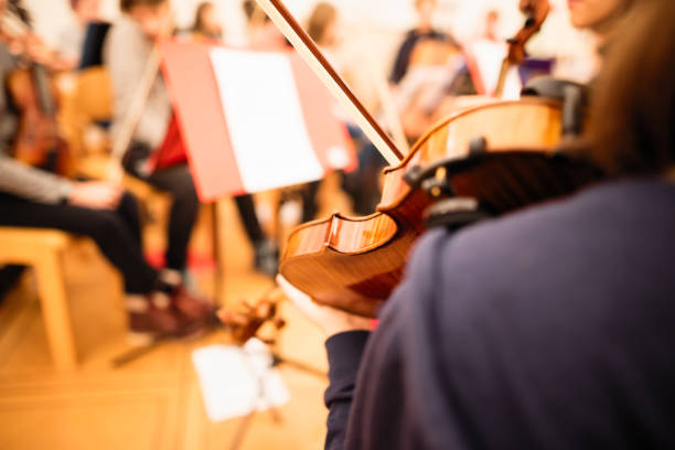 Playing violin in a youth orchestra
