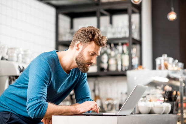 istock Man working with laptop at the cafe 894621626