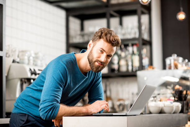 istock Man working with laptop at the cafe 894621642