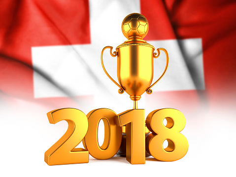 Sport Background with Sport Background with Golden Winner Trophy Cup and 2018 text against the national flag of Switzerland