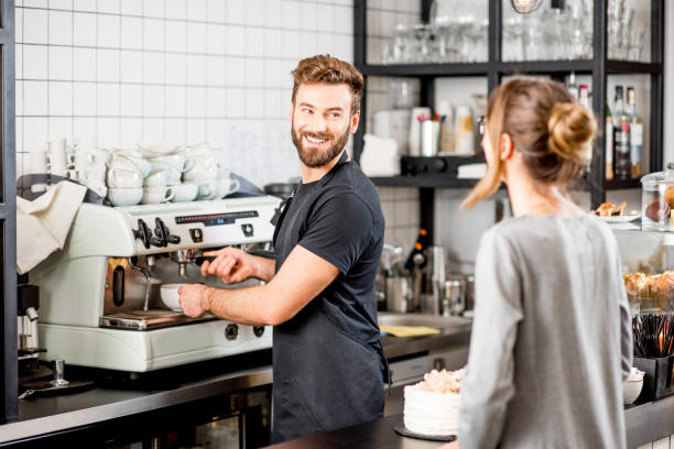 istock Barista with client at the cafe 894623916