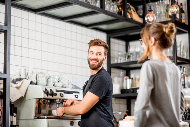 istock Barista with client at the cafe 894623934