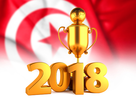 Sport Background with Sport Background with Golden Winner Trophy Cup and 2018 text against the national flag of Tunisia