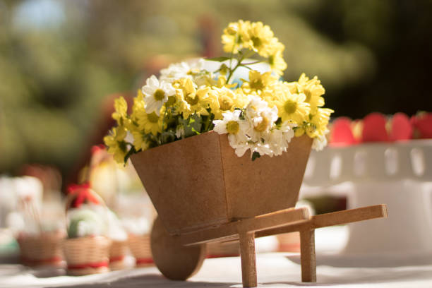 istock Wood Cart Flowers 894627050
