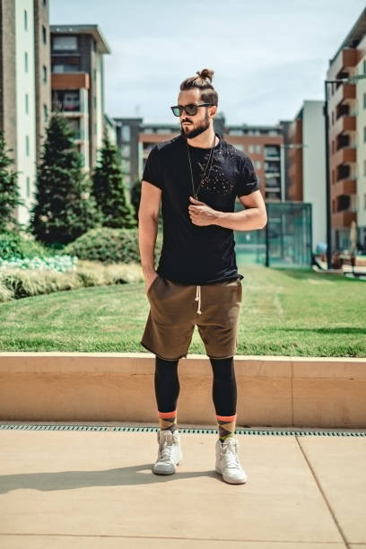 istock Hipster standing  seriously in the street 894632366