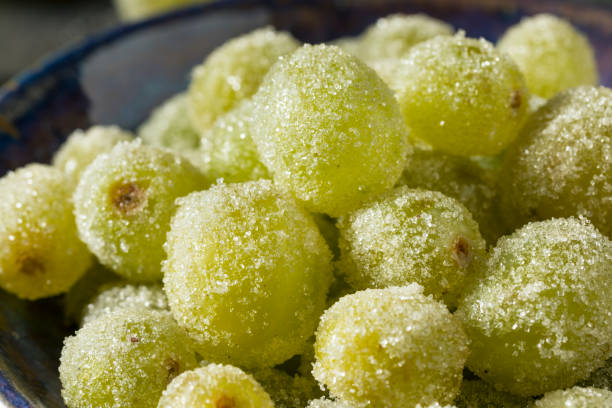 Boozy Sugared Prosecco Grapes Boozy Sugared Prosecco Grapes in a Bowl for Dessert frozen grapes stock pictures, royalty-free photos & images