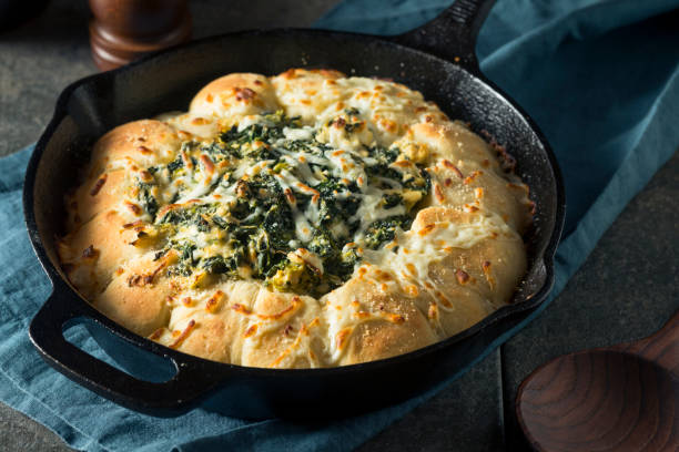 Homemade Skillet Bread with Artichoke Dip Homemade Skillet Bread with Artichoke Dip Ready to Eat dipping sauce photos stock pictures, royalty-free photos & images