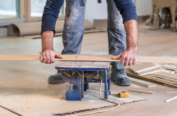istock Carpenter treated board on the circular saw 894641972