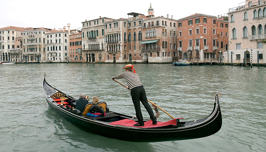 Boatman in a gondola on the Grand Canal in Venice