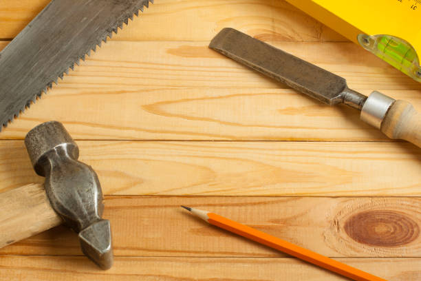istock Carpentry concept.Joiner carpenter workplace. Construction tools on wooden table with shavings. Copy space for text. 894656306