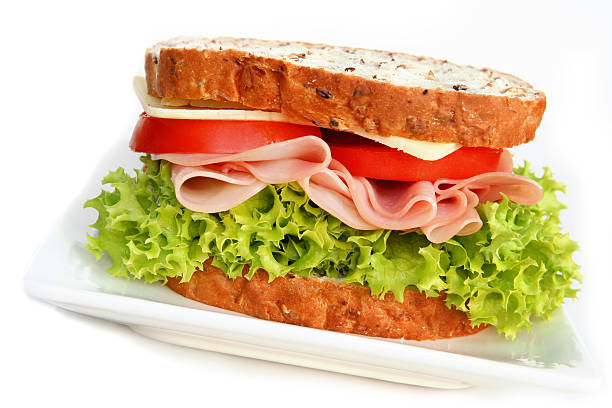 istock Close-up of a ham sandwich with lettuce and tomato 89465874