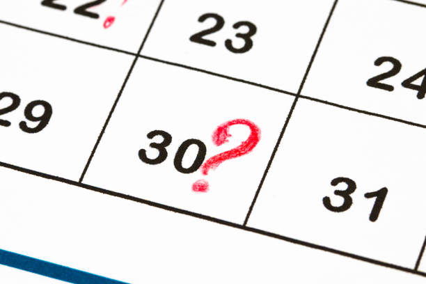 istock Close up a date 30 with red circles on a calendar (end of the month) 894659844