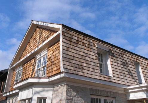 Classic cedar shingle roof on Cape Cod garage in Provincetown MA.